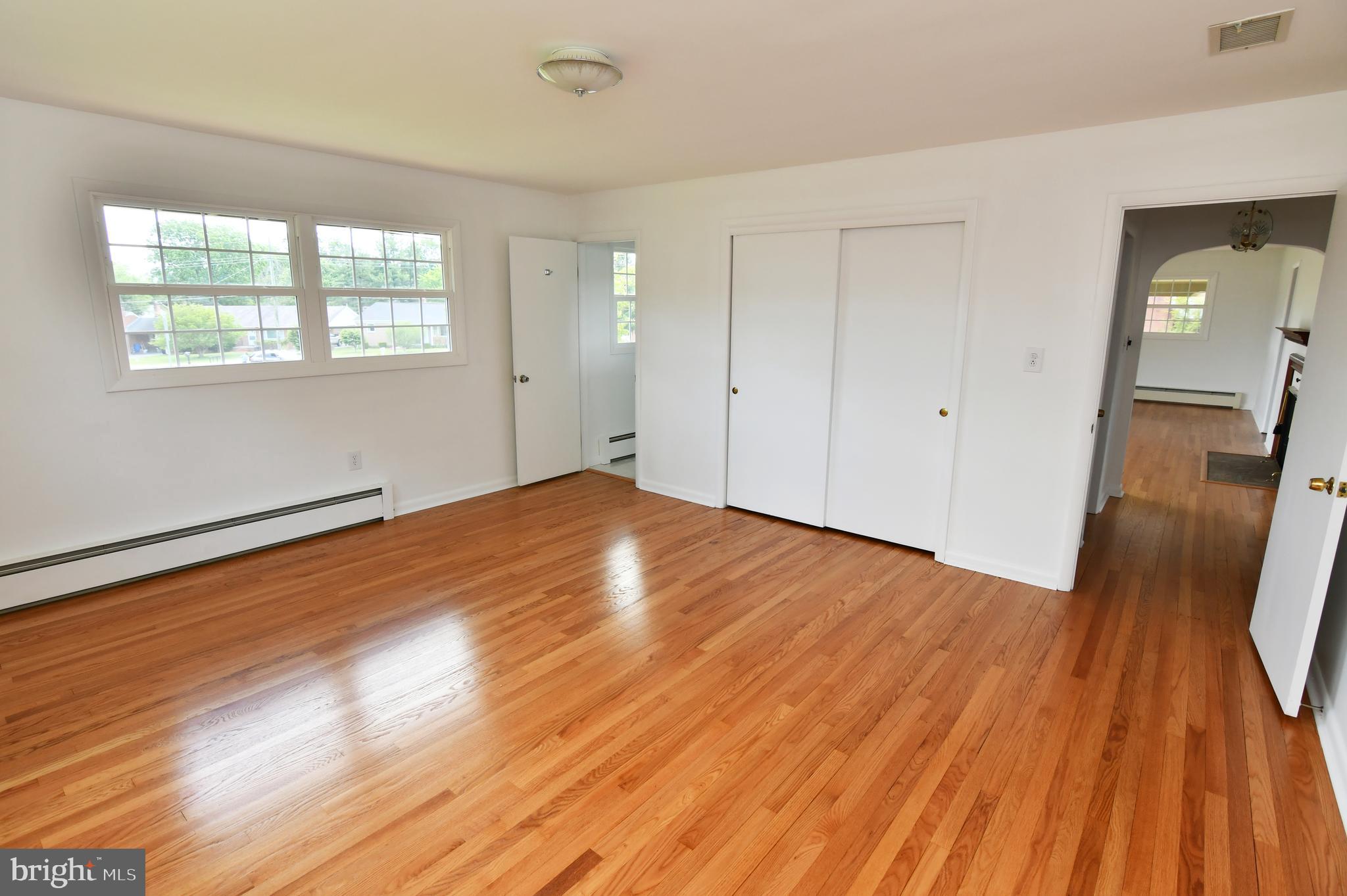 437 Beechcroft Road Winchester, VA 22601 - Photo 24 of 52 a view of empty room with wooden floor and fan