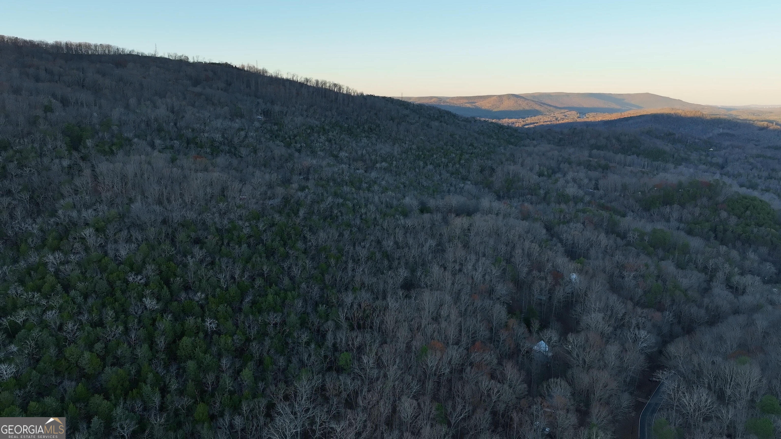 0 Hicks Hollow Road Trenton, GA 30752 - Photo 10 of 17 a view of a lush green hillside and a building