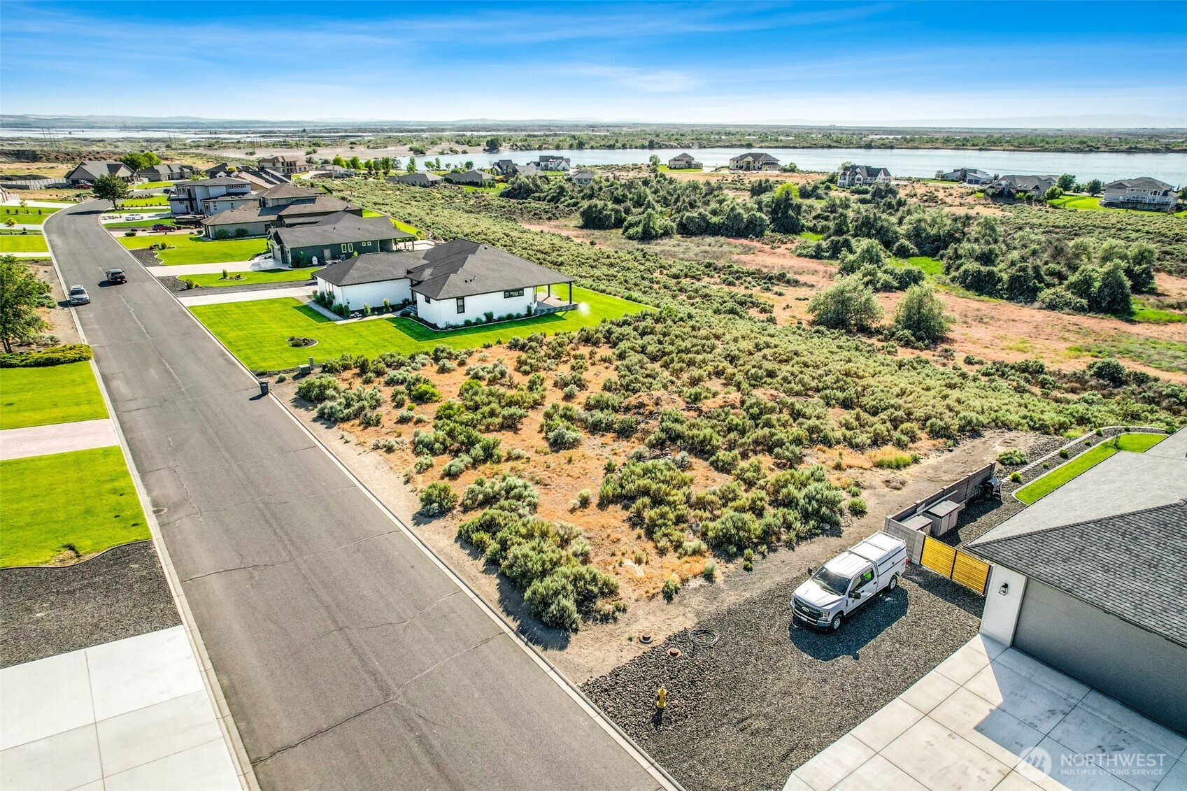 8084 Dune Lake Road Southeast Moses Lake, WA 98837 - Photo 4 of 15 a view of a swimming pool with an outdoor seating