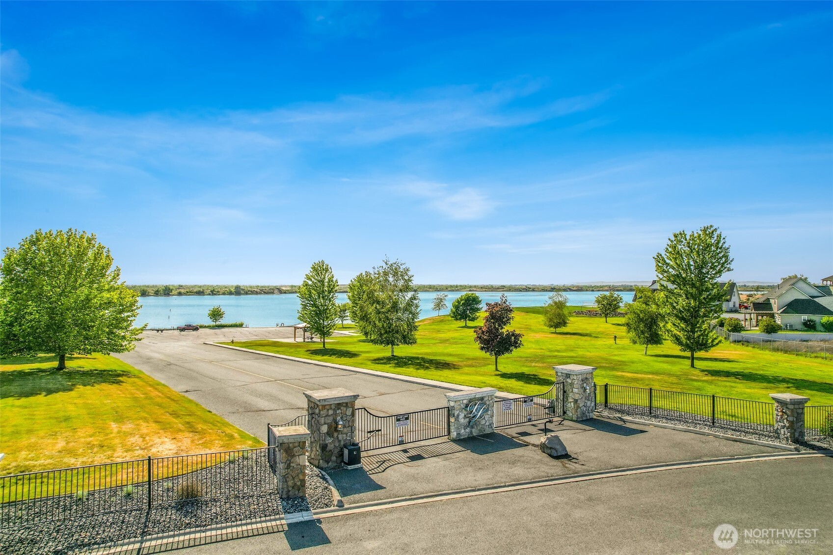 8084 Dune Lake Road Southeast Moses Lake, WA 98837 - Photo 8 of 15 a view of a swimming pool with a yard