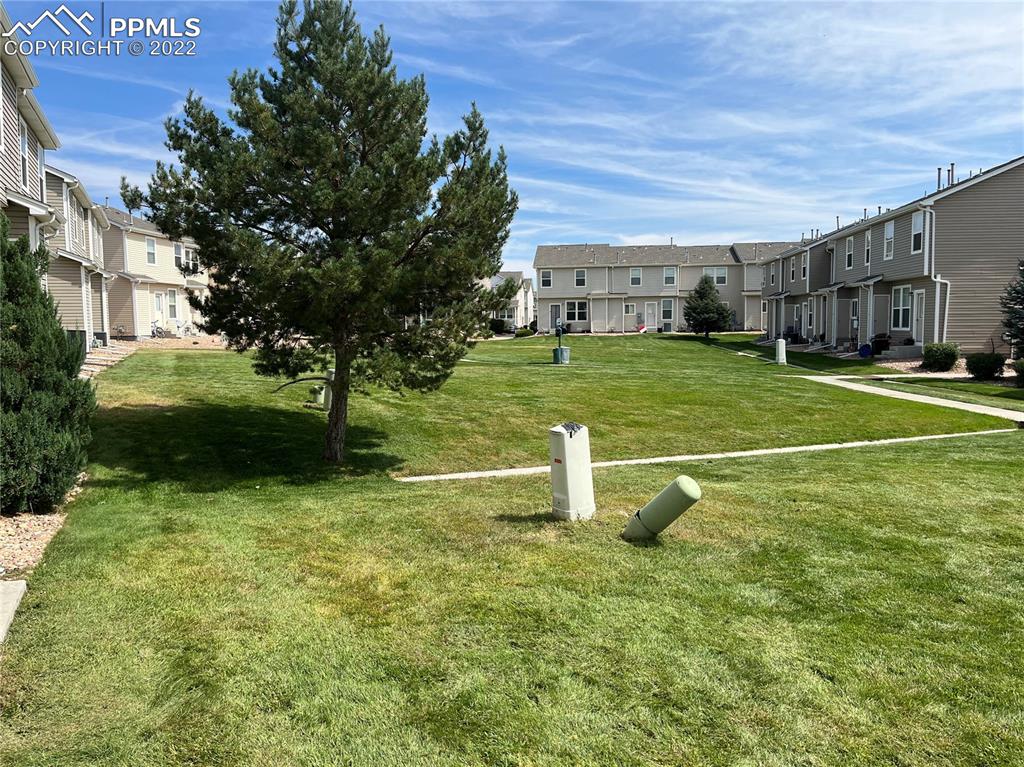 7306 Countryside Grove Fountain, CO 80817 - Photo 4 of 9 a front view of a house with a yard
