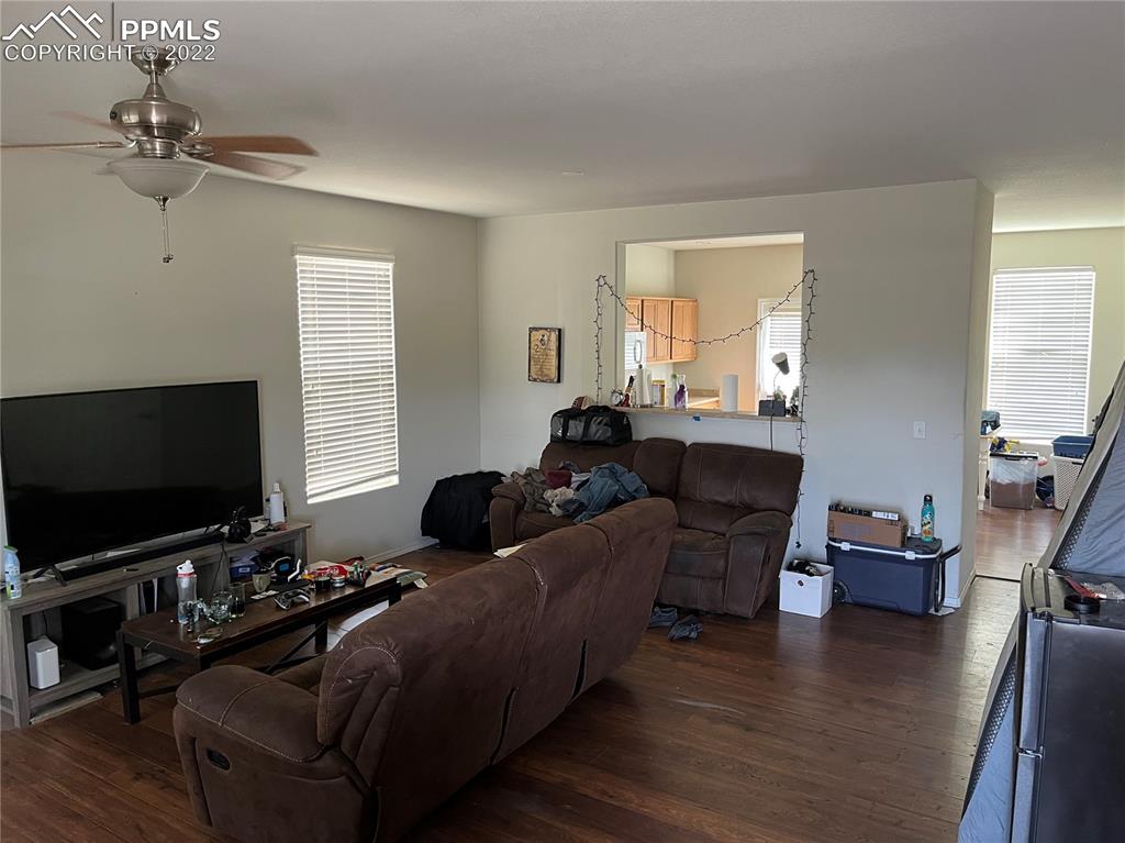 7306 Countryside Grove Fountain, CO 80817 - Photo 5 of 9 a living room with furniture and a flat screen tv