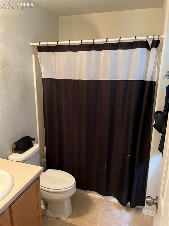 7306 Countryside Grove Fountain, CO 80817 - Photo 9 of 9 a bathroom with a sink and a mirror