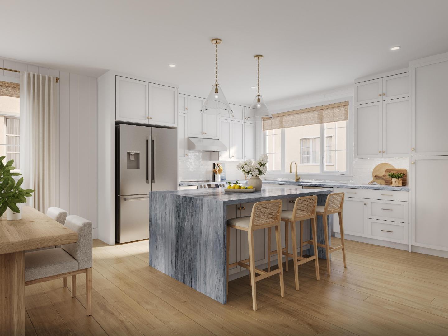 38533 Amaranto Street Newark, CA 94560 - Photo 4 of 7 a kitchen with stainless steel appliances kitchen island granite countertop a table chairs and a refrigerator