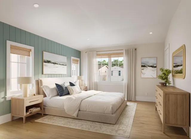 a bedroom with a large bed and a window