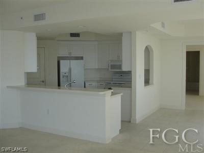 2104 West First Street, Unit 1101 Fort Myers, FL 33901 - Photo 4 of 7 a bathroom with a sink and mirror