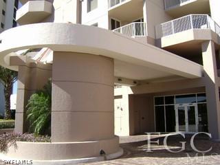 2104 West First Street, Unit 1101 Fort Myers, FL 33901 - Photo 5 of 7 a front view of a house with a yard
