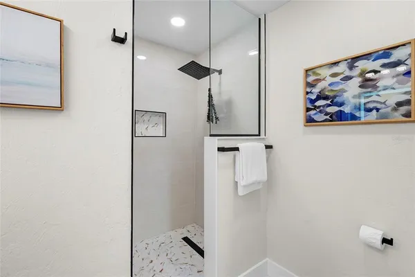 a bathroom with a shower and a sink