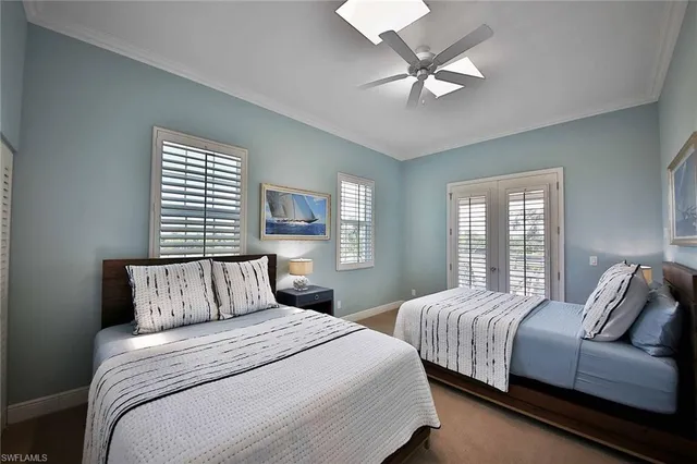 a bedroom with a large bed and a large window