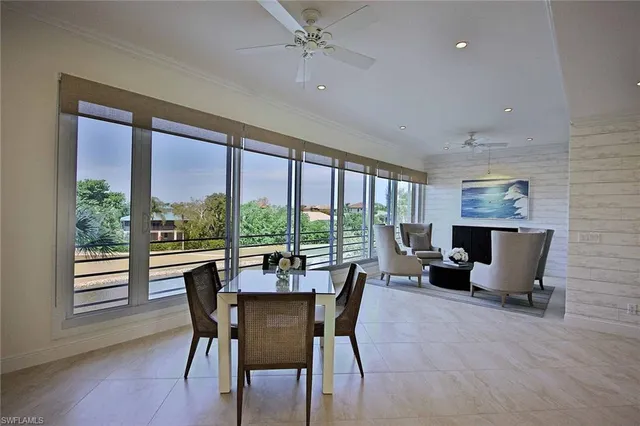 a view of a dining room with furniture window and outside view