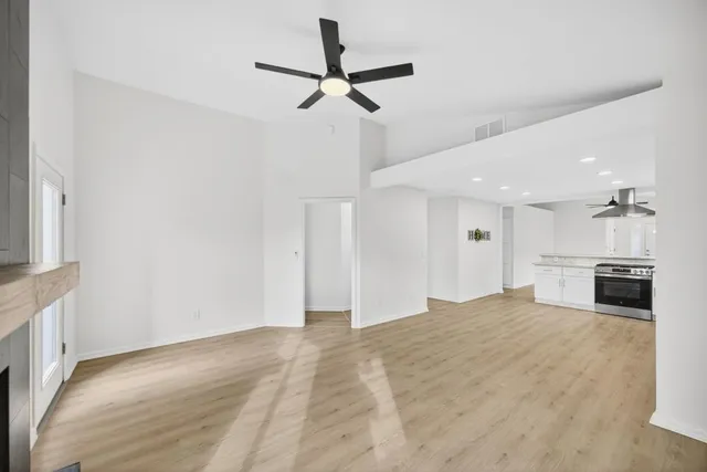 a view of a kitchen with a sink and a window