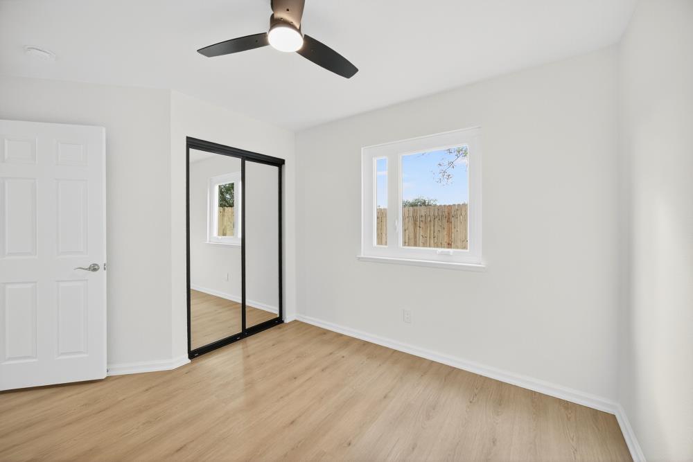 6237 Riverbelle Court Rio Linda, CA 95673 - Photo 24 of 50 a view of an empty room with wooden floor and a window