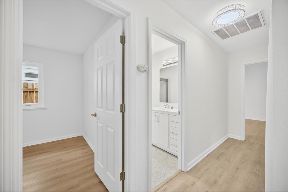 6237 Riverbelle Court Rio Linda, CA 95673 - Photo 25 of 50 a view of a hallway with wooden floor