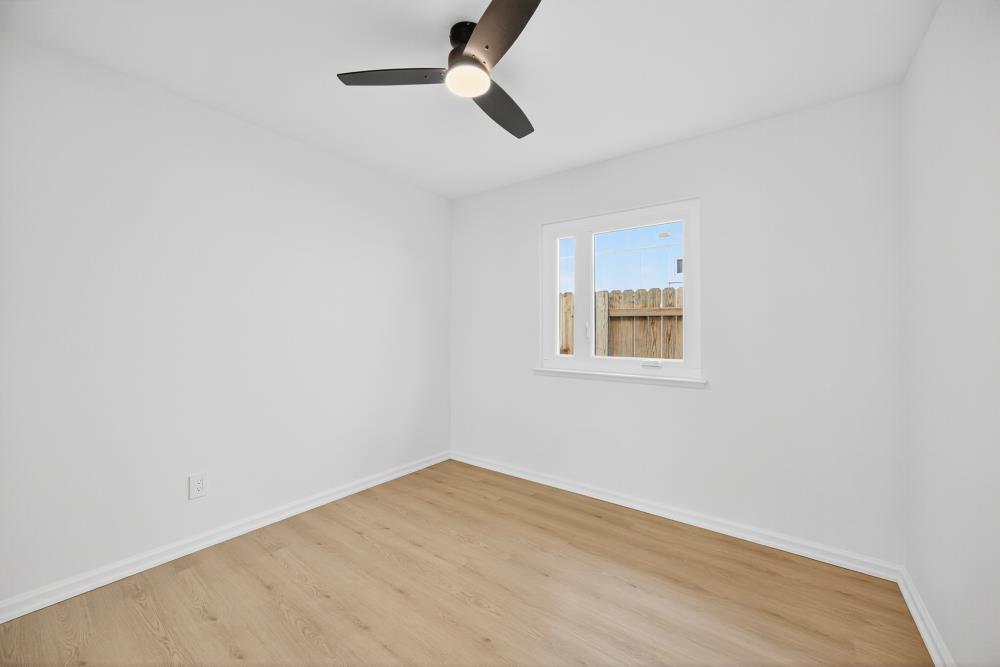 6237 Riverbelle Court Rio Linda, CA 95673 - Photo 26 of 50 an empty room with a window and ceiling fan