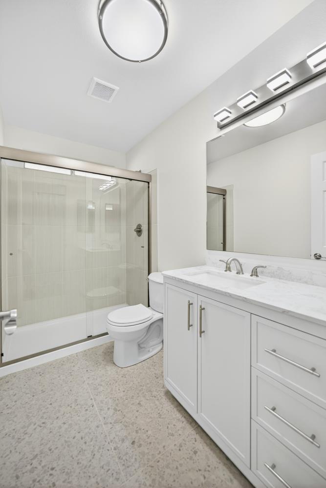 6237 Riverbelle Court Rio Linda, CA 95673 - Photo 29 of 50 a bathroom with a double vanity sink toilet and shower