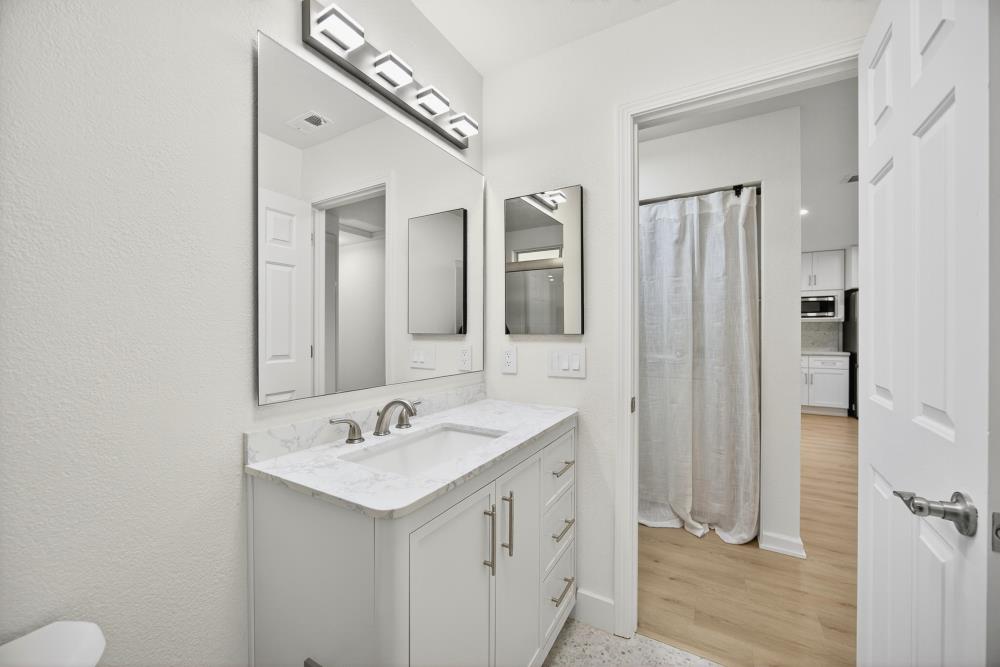 6237 Riverbelle Court Rio Linda, CA 95673 - Photo 31 of 50 a bathroom with a sink and a mirror