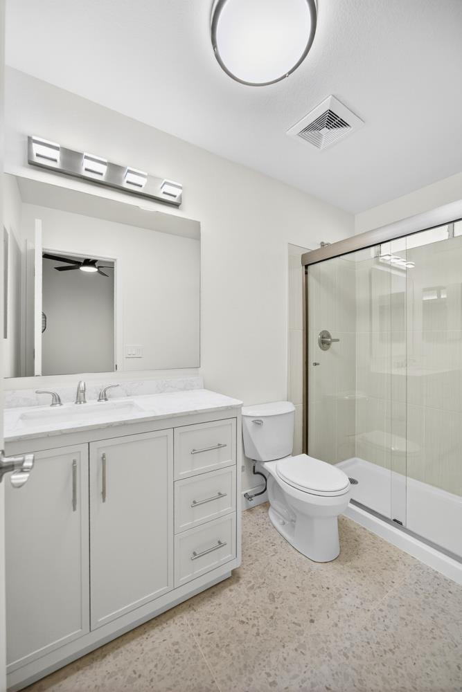 6237 Riverbelle Court Rio Linda, CA 95673 - Photo 38 of 50 a bathroom with a double vanity sink toilet mirror and shower