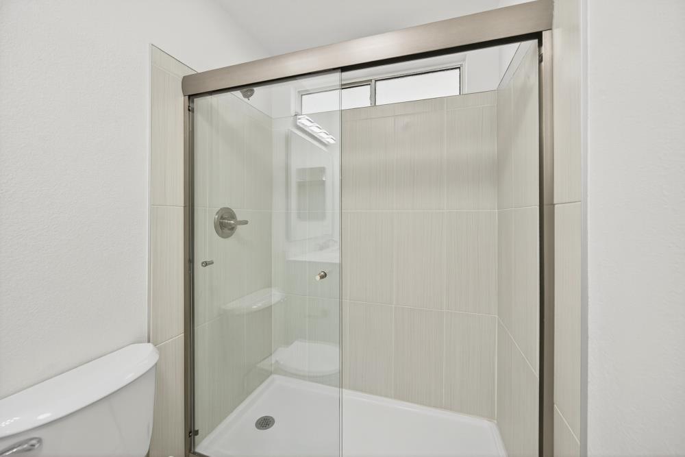 6237 Riverbelle Court Rio Linda, CA 95673 - Photo 39 of 50 a bathroom with a glass shower door