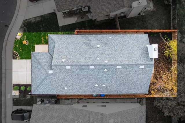 an aerial view of a house with outdoor space