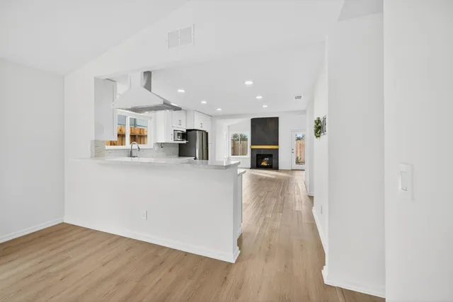 a view of kitchen with wooden floor