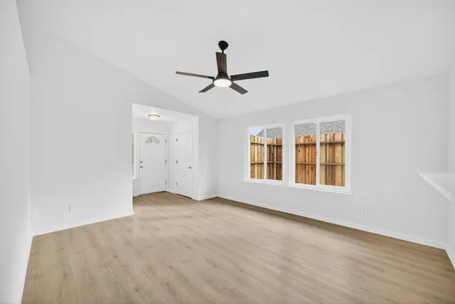 a view of an empty room with a window