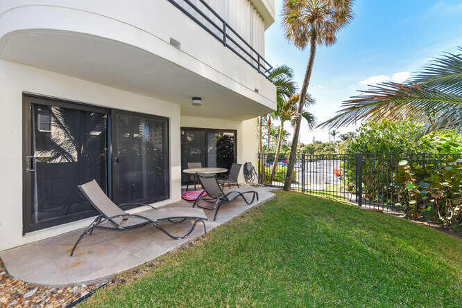 420 Celestial Way, Unit 101 Juno Beach, FL 33408 - Photo 7 of 39 a view of a house with backyard porch and sitting area