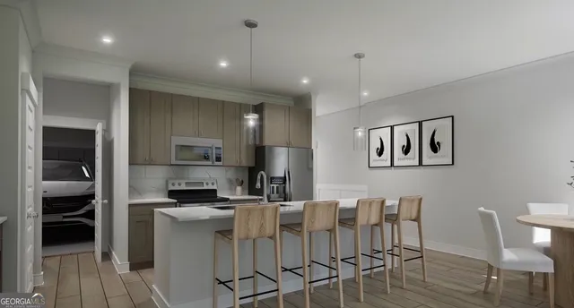 a kitchen with stainless steel appliances kitchen island granite countertop a refrigerator a stove a sink a dining table and chairs with wooden floor