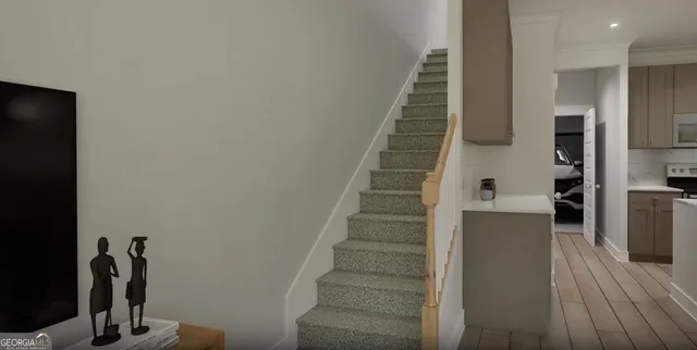 a view of entryway and hall with wooden floor