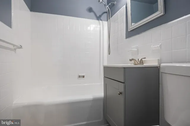 a bathroom with a sink and a bathtub