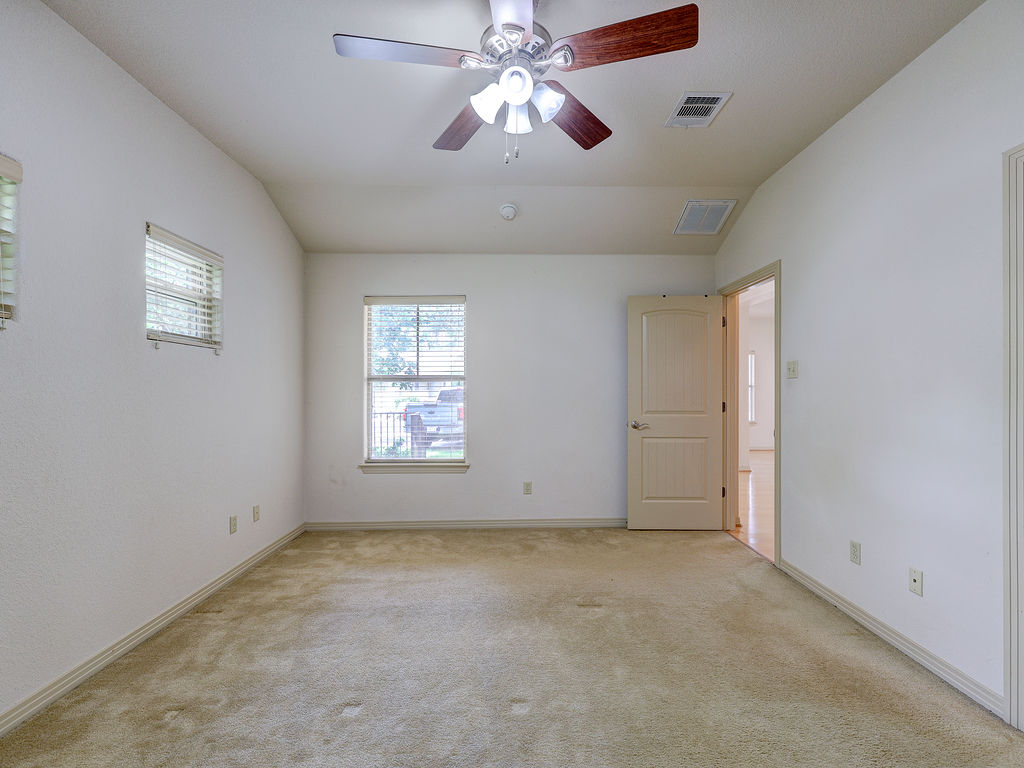9707 Anderson Mill Road, Unit 22 Austin, TX 78750 - Photo 37 of 39 Well-lit room, ideal for flexible living arrangements.