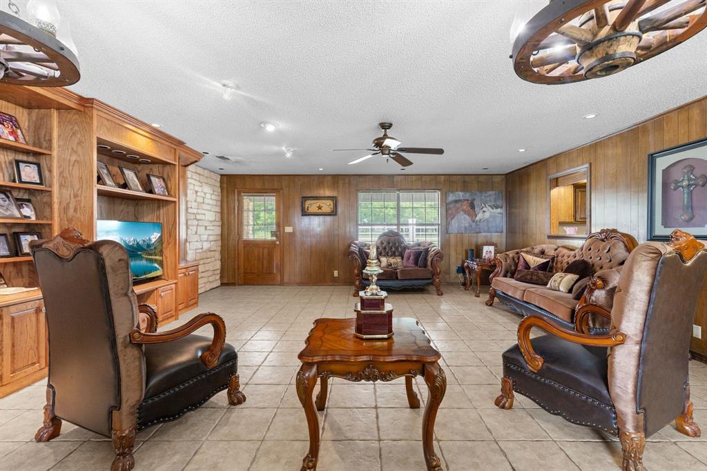 4509 Diamond D Road Lone Oak, TX 75453 - Photo 33 of 36 a living room with furniture and a large window