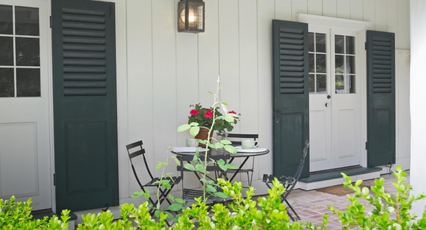 150 Littlefield Road Monterey, CA 93940 - Photo 50 of 51 a balcony with table and chairs and potted plants