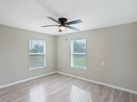 a view of an empty room with a window