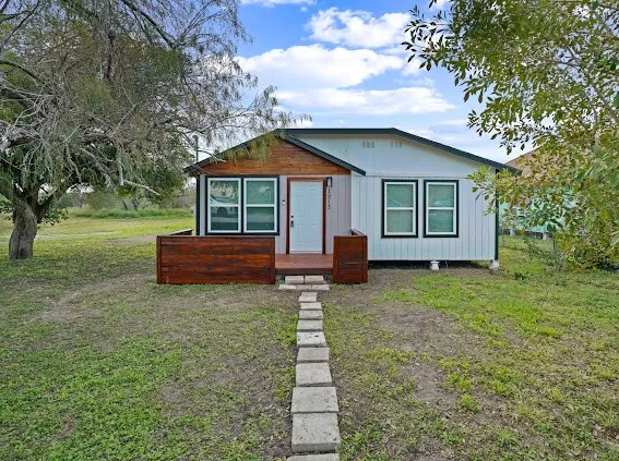 a house view with a garden space