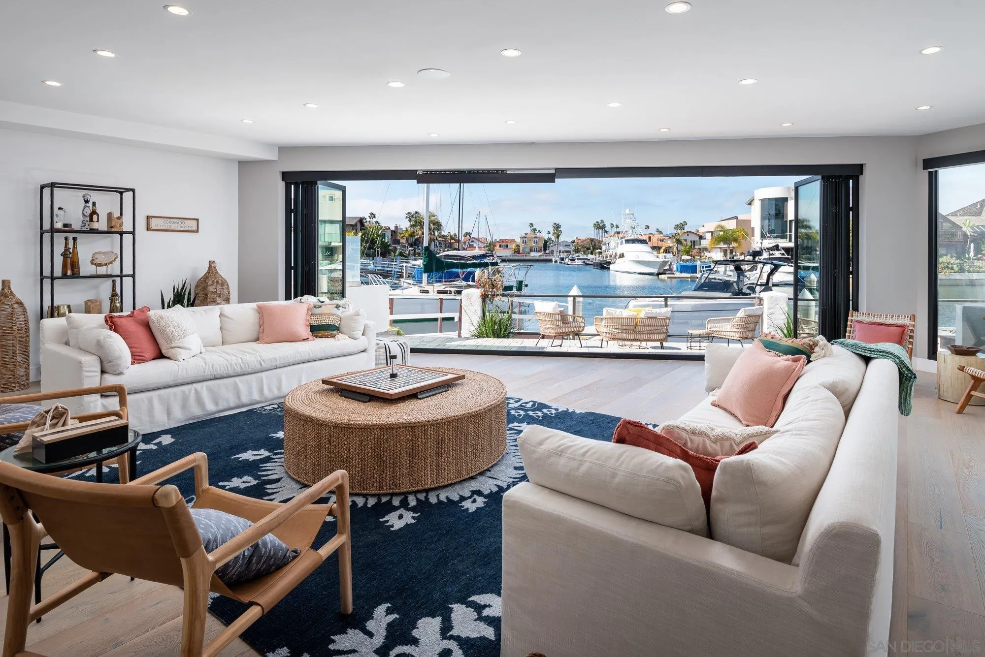 21 Green Turtle Road Coronado, CA 92118 - Photo 1 of 55 a living room with furniture and a large window