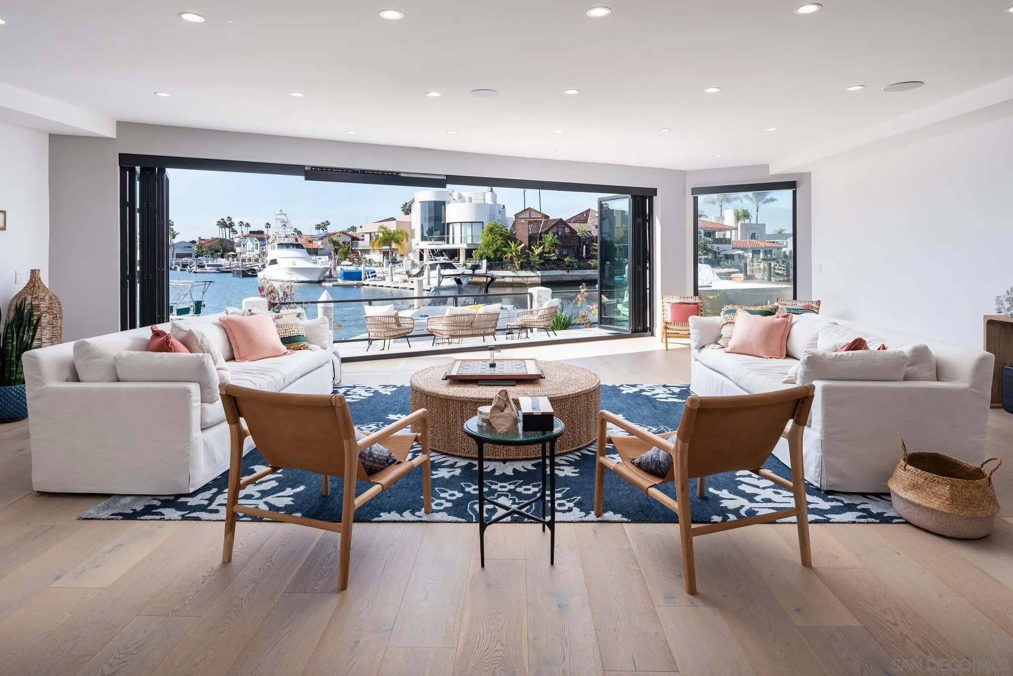 21 Green Turtle Road Coronado, CA 92118 - Photo 11 of 55 a dining room with furniture a large window and a rug