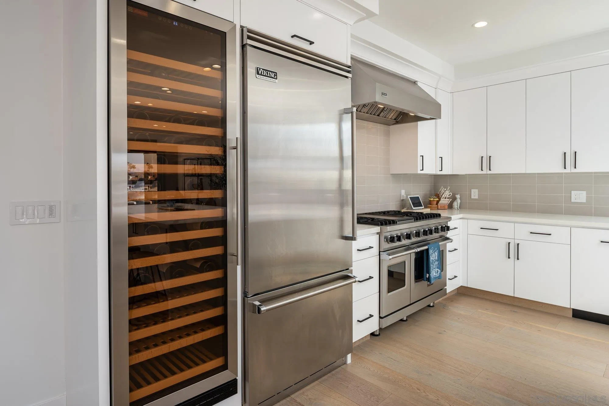 21 Green Turtle Road Coronado, CA 92118 - Photo 20 of 55 a kitchen with cabinets and appliances
