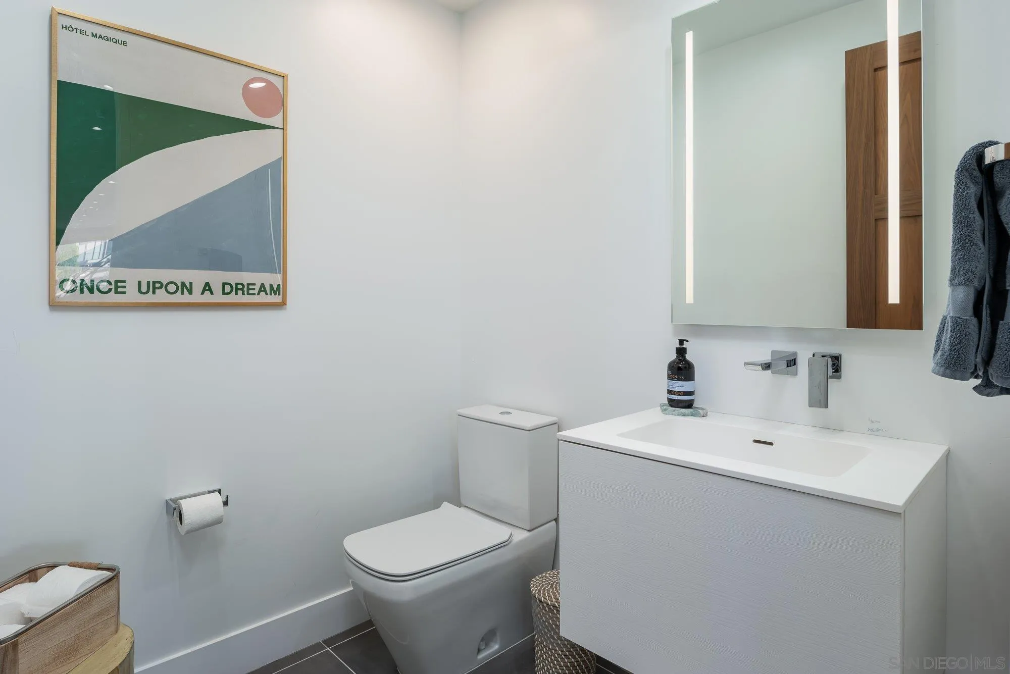 21 Green Turtle Road Coronado, CA 92118 - Photo 22 of 55 a bathroom with a toilet sink and mirror