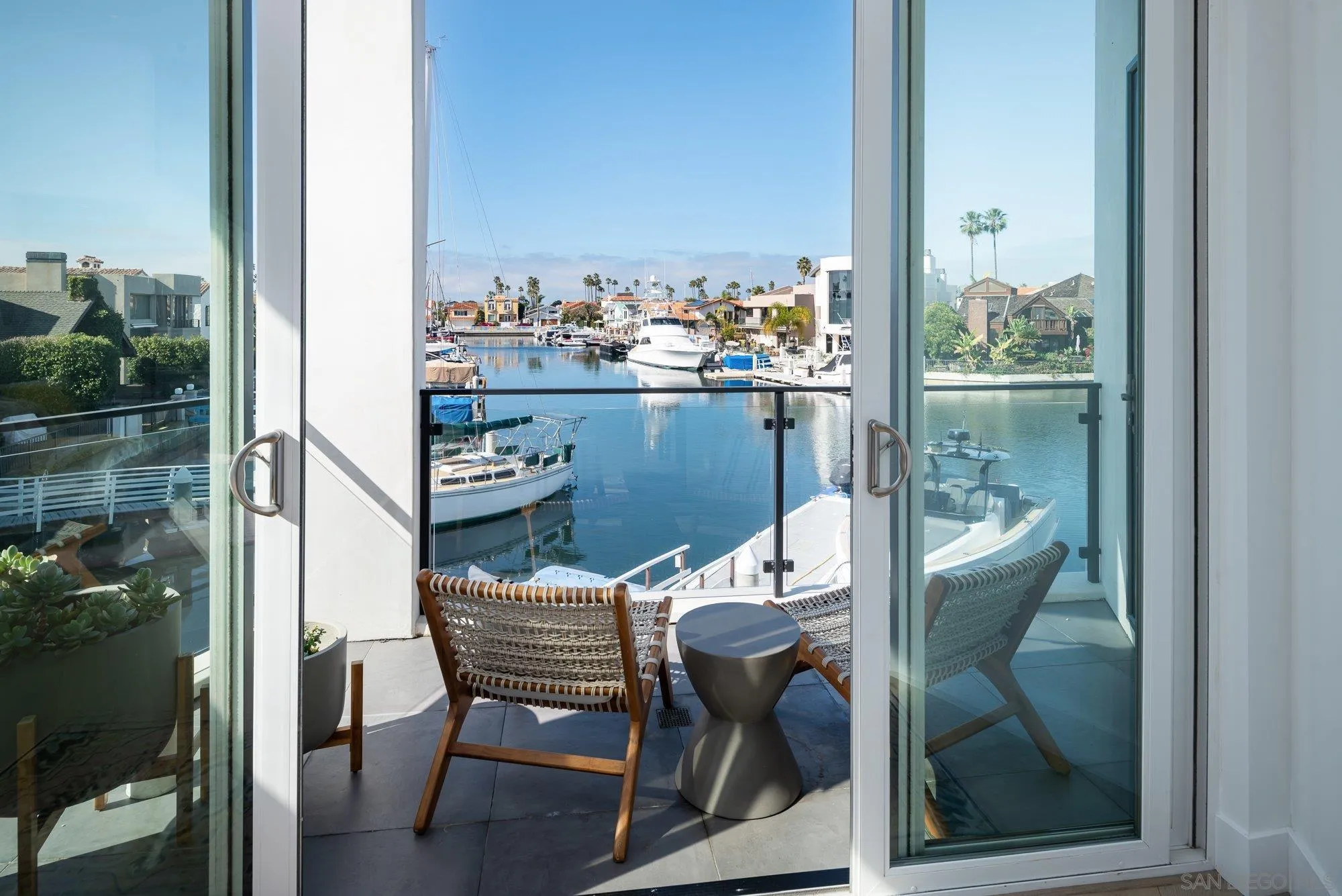 21 Green Turtle Road Coronado, CA 92118 - Photo 27 of 55 a balcony view with a couple of chairs and a table