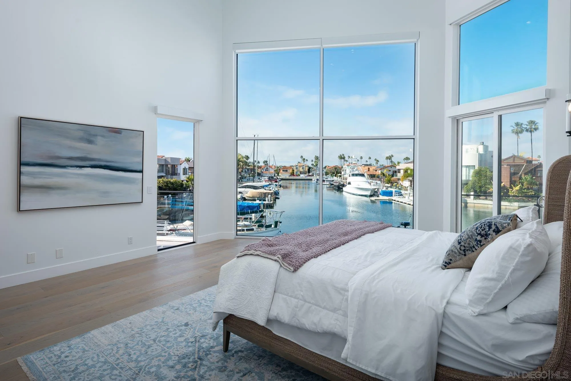 21 Green Turtle Road Coronado, CA 92118 - Photo 32 of 55 a bedroom with a bed and large window