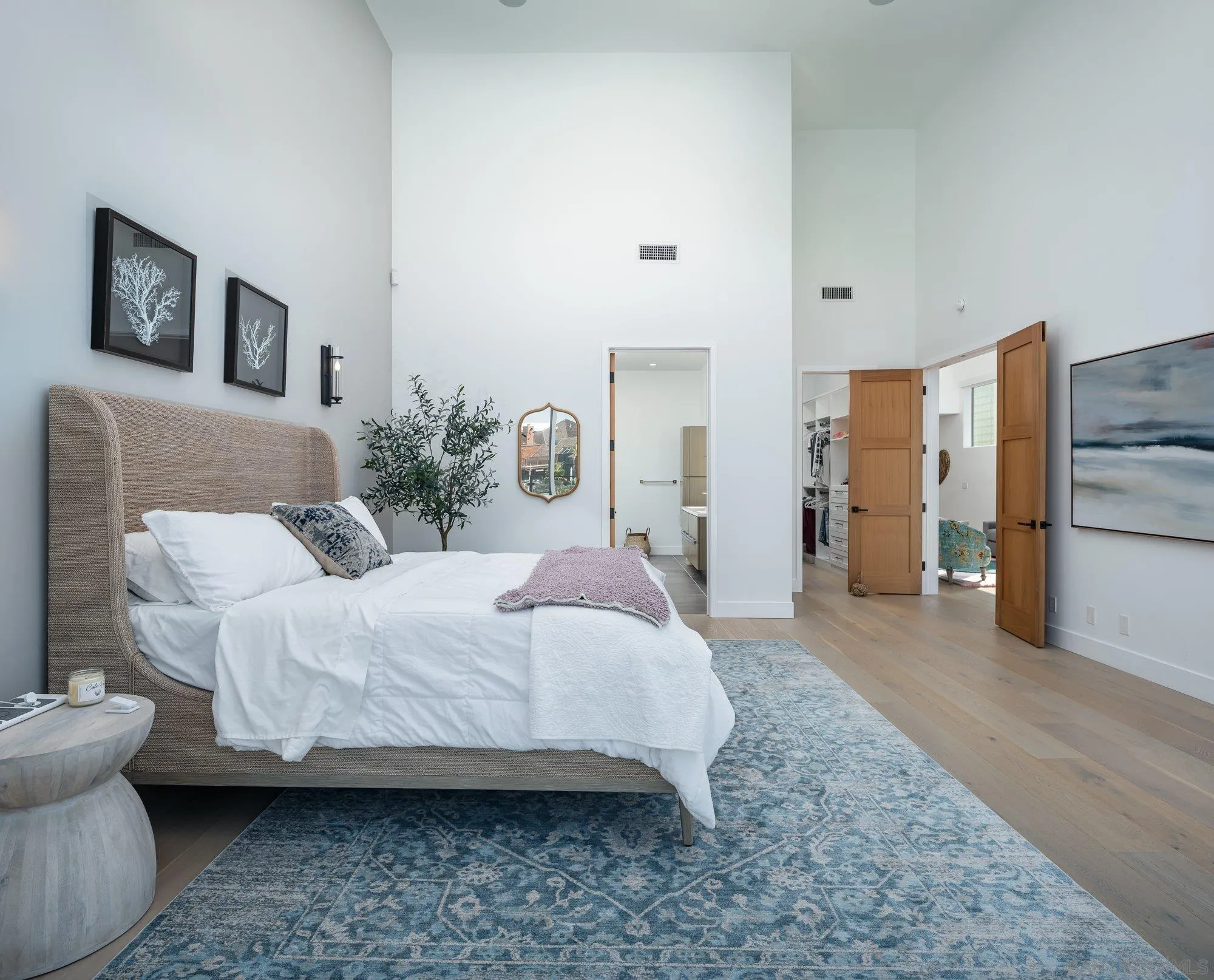 21 Green Turtle Road Coronado, CA 92118 - Photo 34 of 55 a spacious bedroom with a bed and a couch