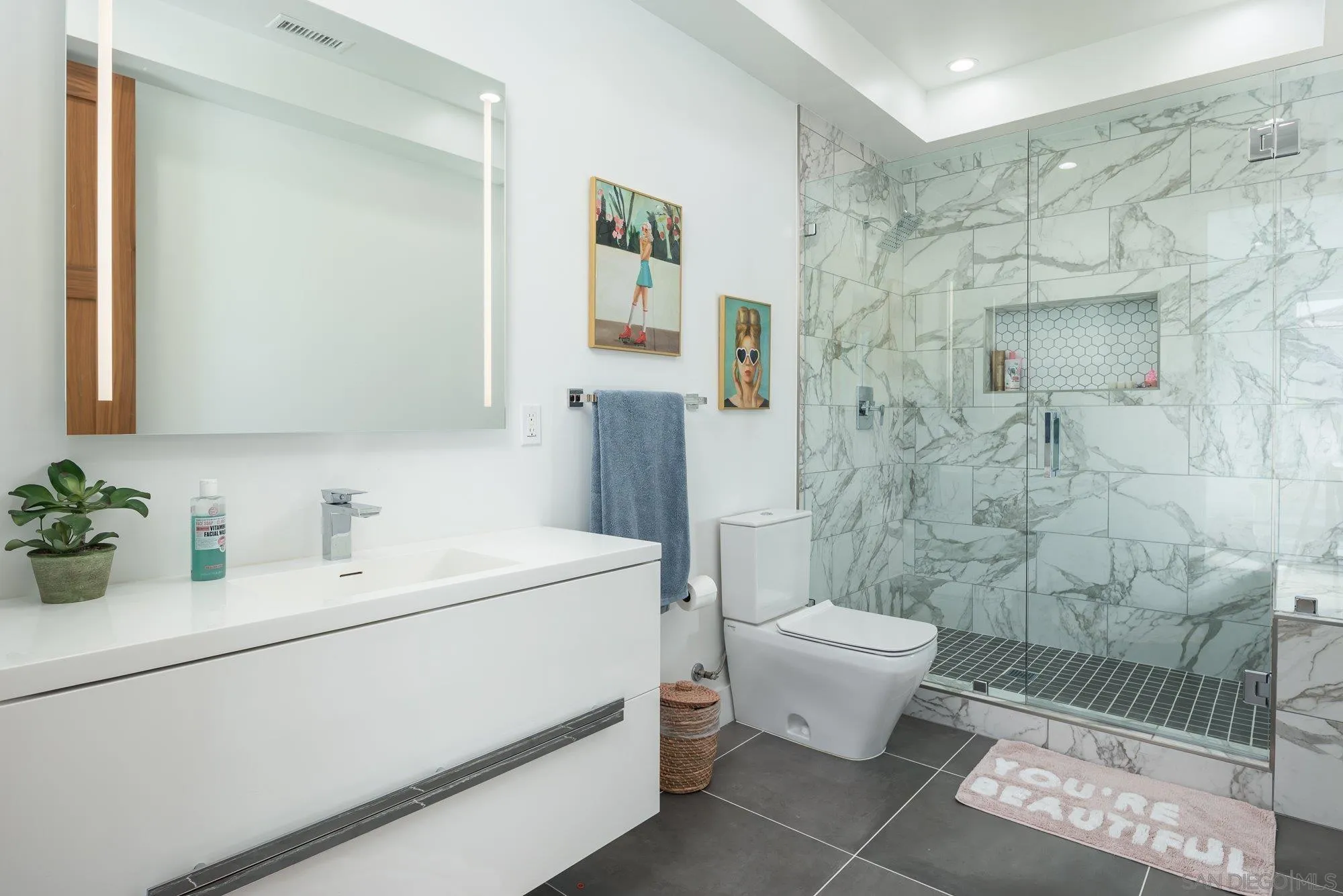 21 Green Turtle Road Coronado, CA 92118 - Photo 43 of 55 a bathroom with a sink toilet and shower