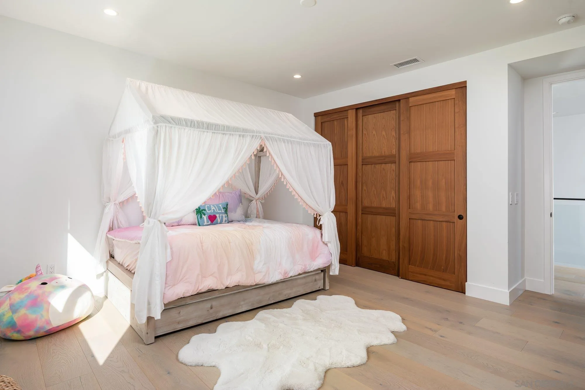 21 Green Turtle Road Coronado, CA 92118 - Photo 44 of 55 a bedroom with a bed and a window