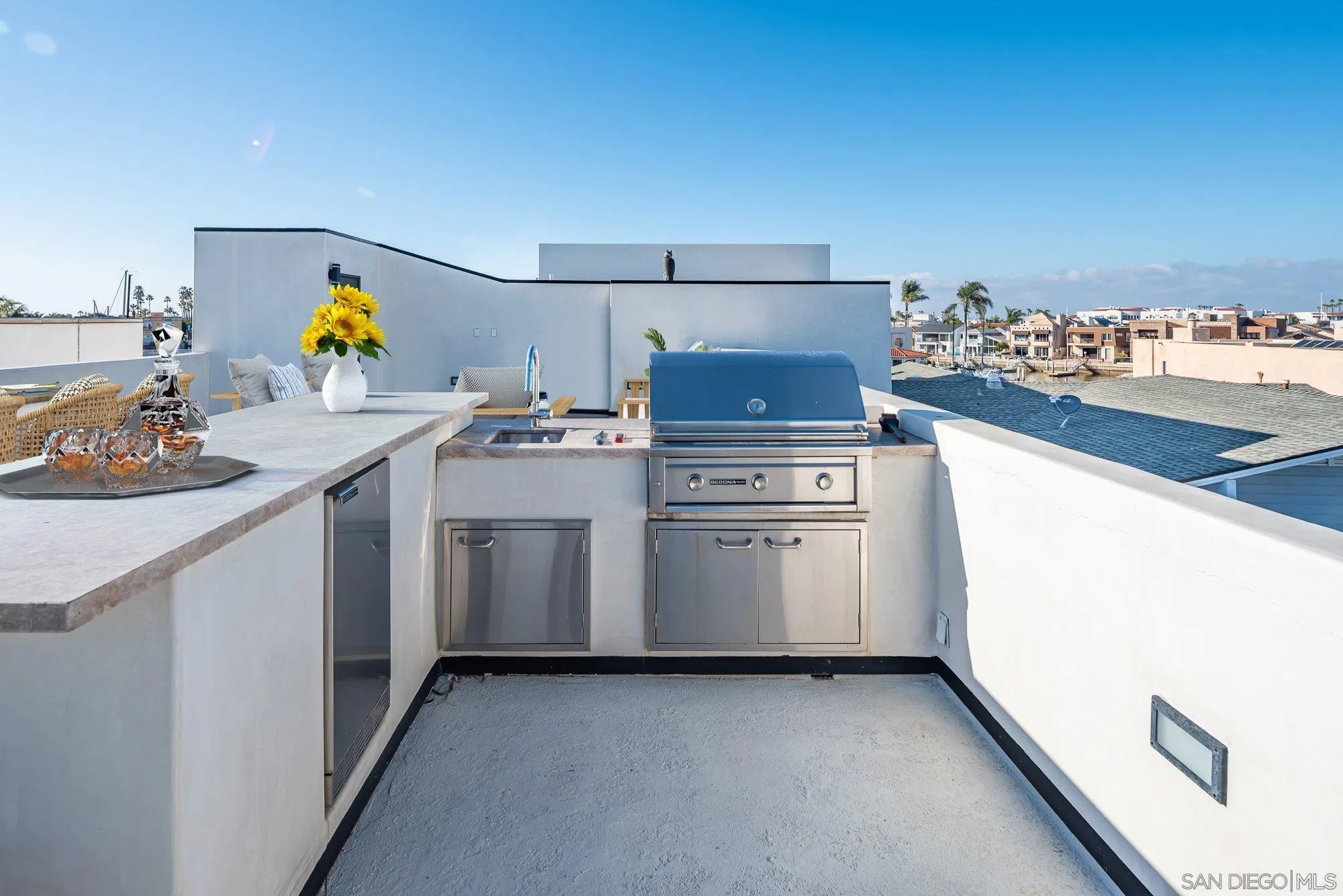 21 Green Turtle Road Coronado, CA 92118 - Photo 48 of 55 a utility room with cabinets washer and dryer
