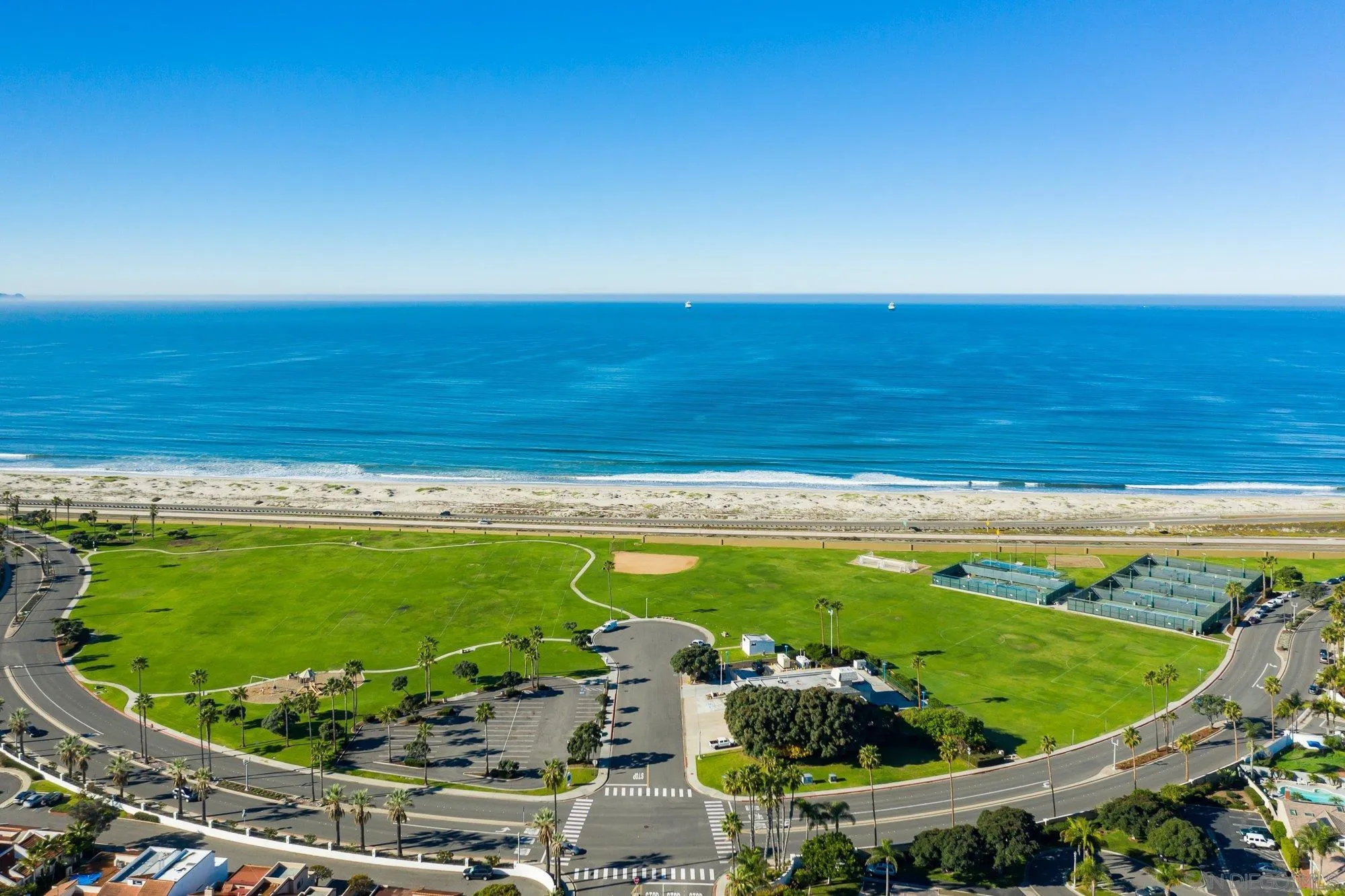 21 Green Turtle Road Coronado, CA 92118 - Photo 54 of 55 a view of a swimming pool with a chairs and floor