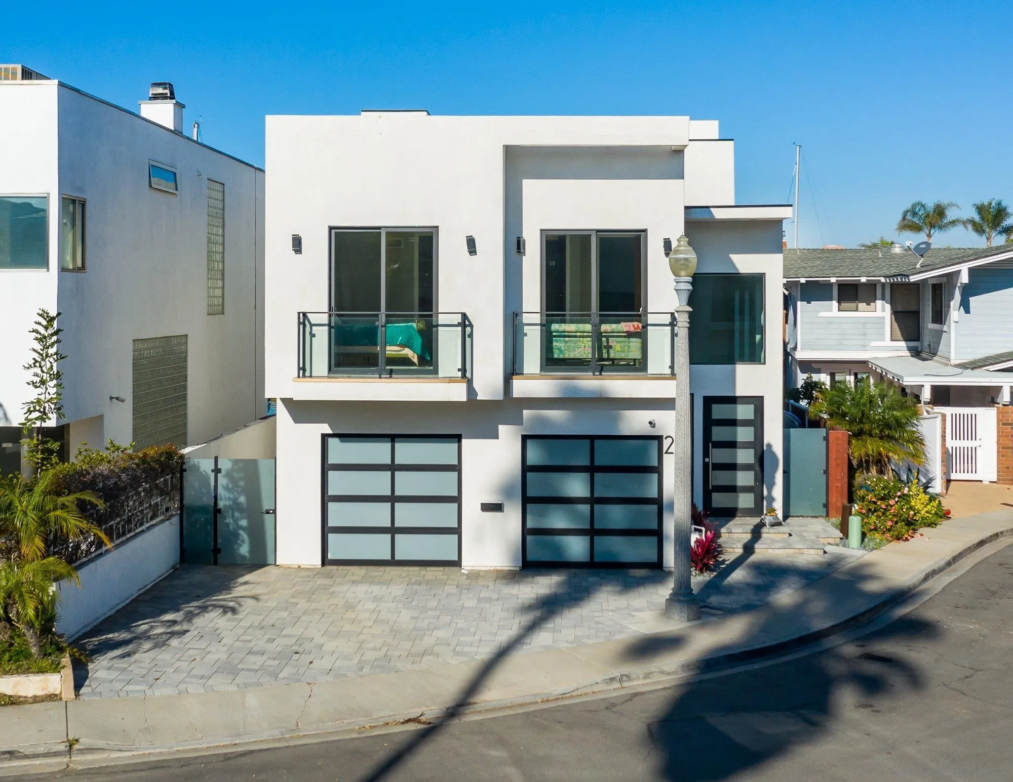 21 Green Turtle Road Coronado, CA 92118 - Photo 8 of 55 a front view of a house with a garage