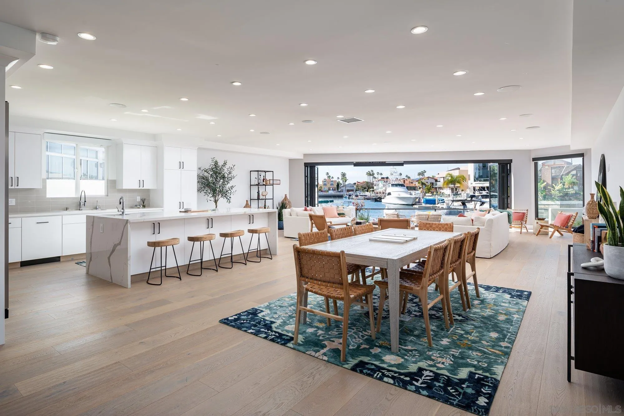 21 Green Turtle Road Coronado, CA 92118 - Photo 10 of 55 a room with lots of wooden furniture a dining table and chairs