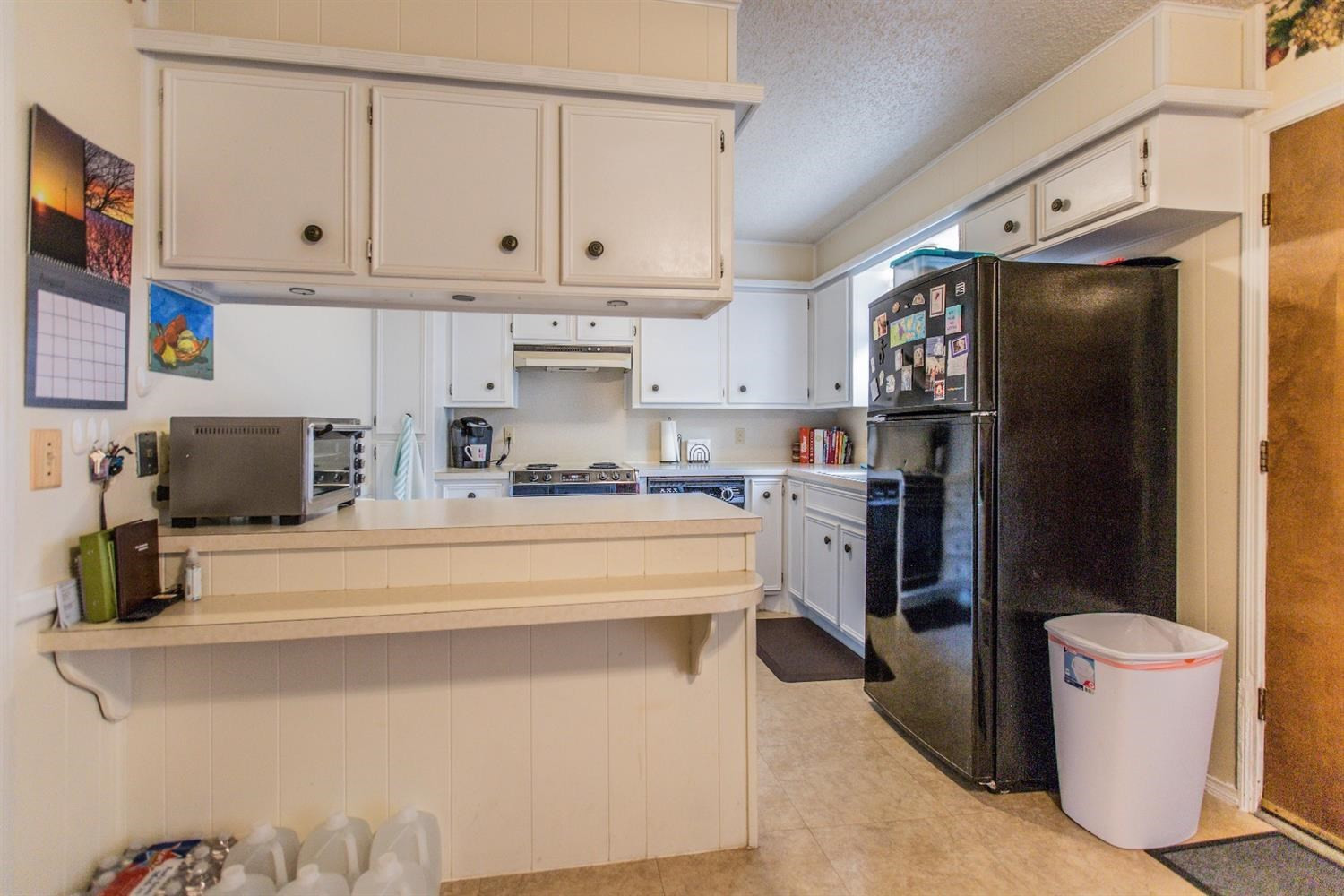 7901 Aberdeen Avenue Lubbock, TX 79424 - Photo 5 of 10 a kitchen with stainless steel appliances a refrigerator sink and stove