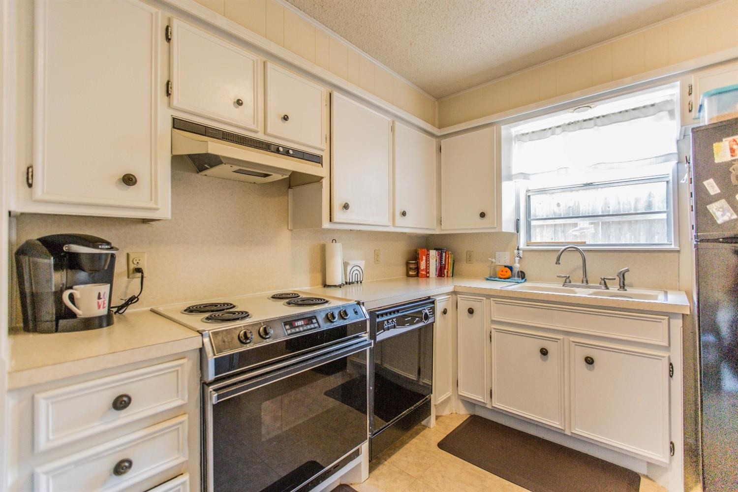 7901 Aberdeen Avenue Lubbock, TX 79424 - Photo 7 of 10 a kitchen with granite countertop a sink stove and cabinets