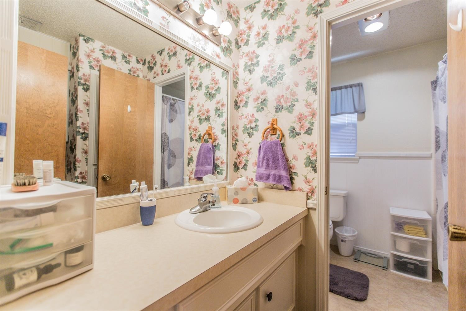 7901 Aberdeen Avenue Lubbock, TX 79424 - Photo 10 of 10 a bathroom with a sink vanity toilet and shower